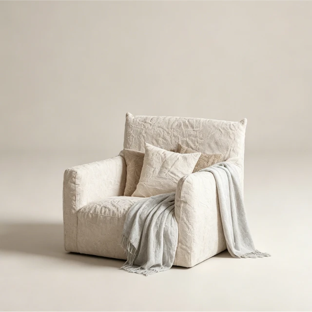 Comfortable cream-colored terry single sofa with blanket and cushion 3d model