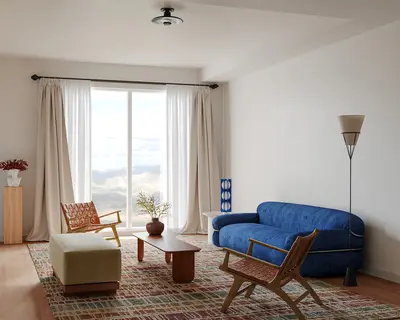 Minimalist Living Room with Blue Sofa and Natural Light 3d model